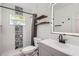 Modern bathroom featuring updated fixtures, decorative tile work, and an LED lighted mirror at 4018 Indianapolis Ne St, St Petersburg, FL 33703