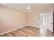Bright bedroom with neutral paint, wood flooring, and an open doorway at 4018 Indianapolis Ne St, St Petersburg, FL 33703