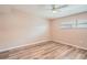 Bedroom with light walls, updated flooring and ceiling fan at 4018 Indianapolis Ne St, St Petersburg, FL 33703