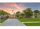 A well-maintained, single-Gathering home with a green lawn and vibrant landscaping at 4018 Indianapolis Ne St, St Petersburg, FL 33703