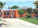 Charming single-story home featuring a well-manicured lawn, inviting front door, and lovely landscaping at 4018 Indianapolis Ne St, St Petersburg, FL 33703