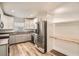 Modern kitchen featuring stainless steel appliances, white cabinets, and light-colored countertops at 4018 Indianapolis Ne St, St Petersburg, FL 33703