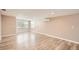 Spacious living room with wood-look floors and bright windows at 4018 Indianapolis Ne St, St Petersburg, FL 33703