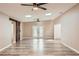 Bright living room featuring laminate floors, skylights, and a stylish sliding barn door at 4018 Indianapolis Ne St, St Petersburg, FL 33703
