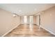 Open-concept living area with sleek wood flooring and recessed lighting at 4018 Indianapolis Ne St, St Petersburg, FL 33703