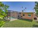 A screened pool surrounded by a well-manicured yard and tropical greenery at 4018 Indianapolis Ne St, St Petersburg, FL 33703