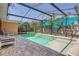 Sparkling screened-in pool with comfortable seating at 4018 Indianapolis Ne St, St Petersburg, FL 33703