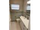 Cozy bathroom with a white vanity, tiled walls, and a functional layout for everyday use at 419 12Th Ave, Indian Rocks Beach, FL 33785