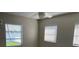 A bright room with three windows offering natural light and serene water views at 419 12Th Ave, Indian Rocks Beach, FL 33785