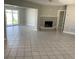 Spacious living room with tiled floors, a fireplace, and sliding glass doors to the backyard at 419 12Th Ave, Indian Rocks Beach, FL 33785