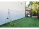 The backyard features an artificial turf play area, enhanced by a soccer goal for recreational activities at 4204 W San Juan St, Tampa, FL 33629