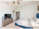 Bright bedroom features a ceiling fan, large closet, and contemporary decor and furnishings at 4204 W San Juan St, Tampa, FL 33629