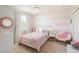 Bright bedroom with colorful decor, stylish chandelier, modern decor, and plush chair at 4204 W San Juan St, Tampa, FL 33629