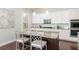 Beautiful kitchen island with granite countertops and a view of stainless steel appliances at 4204 W San Juan St, Tampa, FL 33629