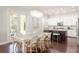 Bright kitchen featuring a dining table and a view of the modern kitchen appliances at 4204 W San Juan St, Tampa, FL 33629