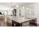 Open-concept kitchen with granite countertops, stainless steel appliances, and dining area at 4204 W San Juan St, Tampa, FL 33629