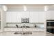 Stylish kitchen with granite countertops, stainless steel appliances, and ample cabinet space at 4204 W San Juan St, Tampa, FL 33629