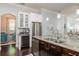 Spacious kitchen island with stainless steel appliances, wine cooler, and adjacent living area at 4204 W San Juan St, Tampa, FL 33629