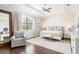 Bright main bedroom features tray ceiling, hardwood floors, large windows and neutral decor at 4204 W San Juan St, Tampa, FL 33629