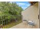 Private balcony with comfortable seating, perfect for enjoying the surrounding greenery at 4215 E Bay Dr # 1806D, Clearwater, FL 33764