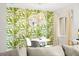 Dining area with leafy wallpaper, complemented by a stylish pendant light and a modern round table at 4215 E Bay Dr # 1806D, Clearwater, FL 33764