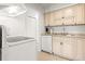 Clean kitchen featuring neutral cabinets, granite countertops, and updated appliances at 4215 E Bay Dr # 1806D, Clearwater, FL 33764