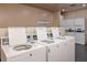 Bright laundry room featuring multiple high efficiency washers and dryers for resident's convenience at 4215 E Bay Dr # 1806D, Clearwater, FL 33764
