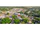 An aerial view showcasing the home's location in relation to nearby apartments, businesses, and roadways at 6328 S Harold Ave, Tampa, FL 33616