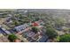 Aerial view showing the home's location within a residential neighborhood and surrounding foliage at 6328 S Harold Ave, Tampa, FL 33616