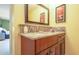 This bathroom offers a granite vanity and a view of the bedroom at 6328 S Harold Ave, Tampa, FL 33616