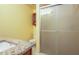 Modern bathroom featuring glass enclosed shower, cherry cabinet, and granite countertop at 6328 S Harold Ave, Tampa, FL 33616