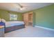 Comfortable bedroom featuring light walls, ceiling fan, and built-in storage at 6328 S Harold Ave, Tampa, FL 33616
