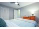 Bedroom with ample closet space, ceiling fan and dresser with lamp at 6328 S Harold Ave, Tampa, FL 33616