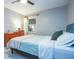 Bright bedroom with a plush bed, ceiling fan and view to the outside at 6328 S Harold Ave, Tampa, FL 33616