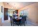 Dining room with a large table and dark wood accents next to the kitchen at 6328 S Harold Ave, Tampa, FL 33616