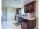 Beautiful kitchen features dark cabinetry, granite countertops, stainless steel appliances at 6328 S Harold Ave, Tampa, FL 33616