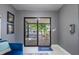View to patio and outdoor space from living room with decorations at 6328 S Harold Ave, Tampa, FL 33616