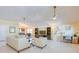 Spacious living room with ample seating, tile floors and natural light perfect for relaxing at 6328 S Harold Ave, Tampa, FL 33616