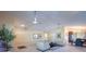 Open-concept living room with bright lighting and easy access to dining area and kitchen at 6328 S Harold Ave, Tampa, FL 33616