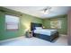 Inviting main bedroom with a large window, ceiling fan, and ample closet space at 6328 S Harold Ave, Tampa, FL 33616