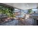 Outdoor patio featuring a full kitchen, dining table, grill and overhead coverage at 6328 S Harold Ave, Tampa, FL 33616