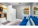 Sitting room entrance to kitchen with modern storage, natural light and decor at 6328 S Harold Ave, Tampa, FL 33616