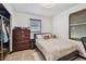 Bedroom with a closet, window with blinds, and neutral toned decor at 8431 52Nd N Way, Pinellas Park, FL 33781