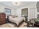 Bedroom with a desk space, closet, and neutral toned decor at 8431 52Nd N Way, Pinellas Park, FL 33781