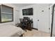 Bedroom featuring wood blinds, tiled floors, and a built-in desk at 8431 52Nd N Way, Pinellas Park, FL 33781