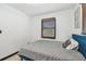 Bedroom featuring a blue bed frame and natural light from the window with closed brown blinds at 8431 52Nd N Way, Pinellas Park, FL 33781