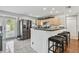 Bright kitchen features stainless steel appliances, breakfast bar with seating, and easy access to the outdoors at 8431 52Nd N Way, Pinellas Park, FL 33781