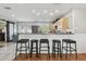 View of the breakfast bar, showcasing barstools and adjacent kitchen space at 8431 52Nd N Way, Pinellas Park, FL 33781