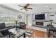 Cozy living area featuring a TV over an electric fireplace and comfortable seating at 8431 52Nd N Way, Pinellas Park, FL 33781