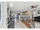 Open-concept living area showcasing modern design elements, tile flooring, and a cozy seating arrangement at 8431 52Nd N Way, Pinellas Park, FL 33781
